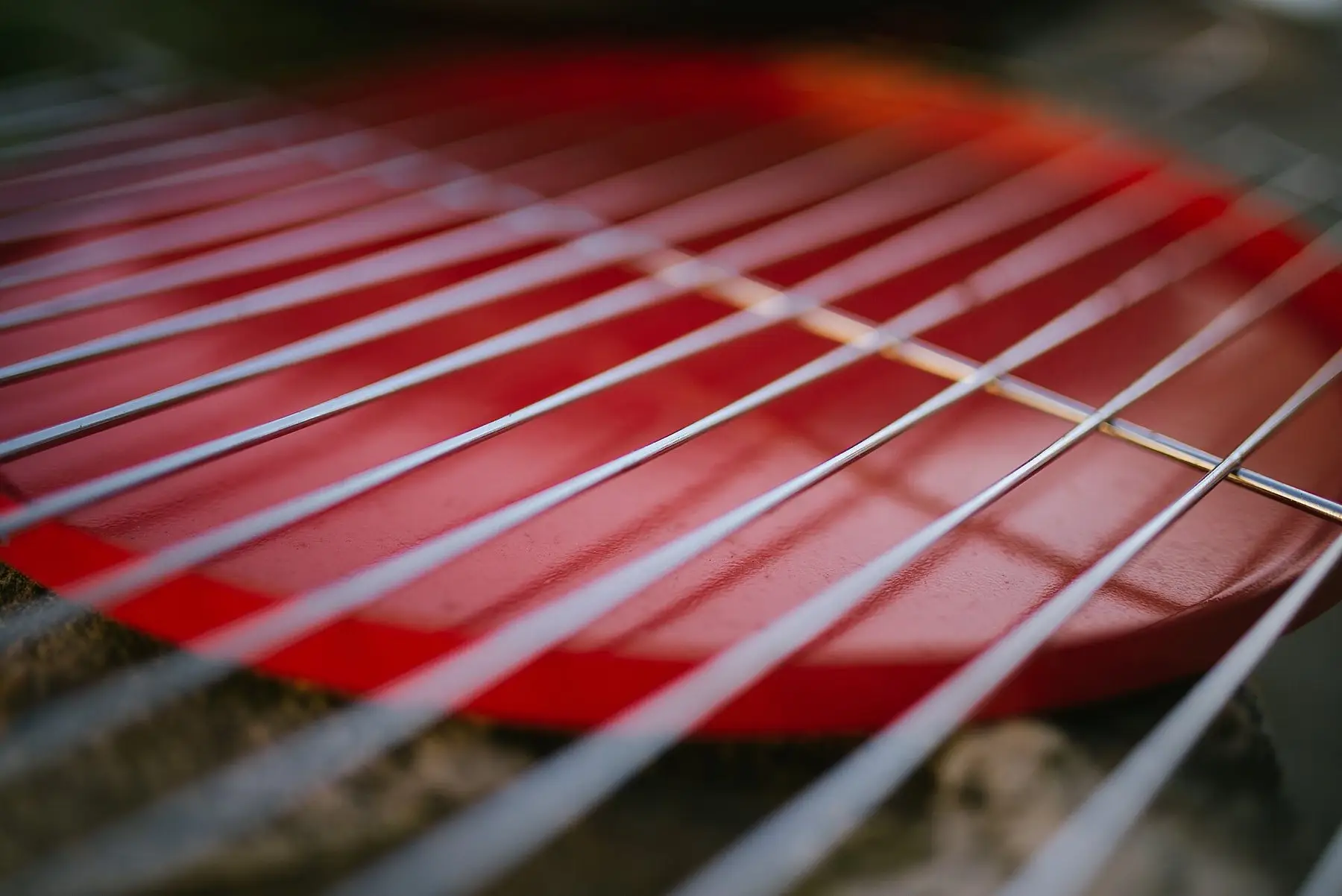 Close-up of the metal cooking grates on a red grill