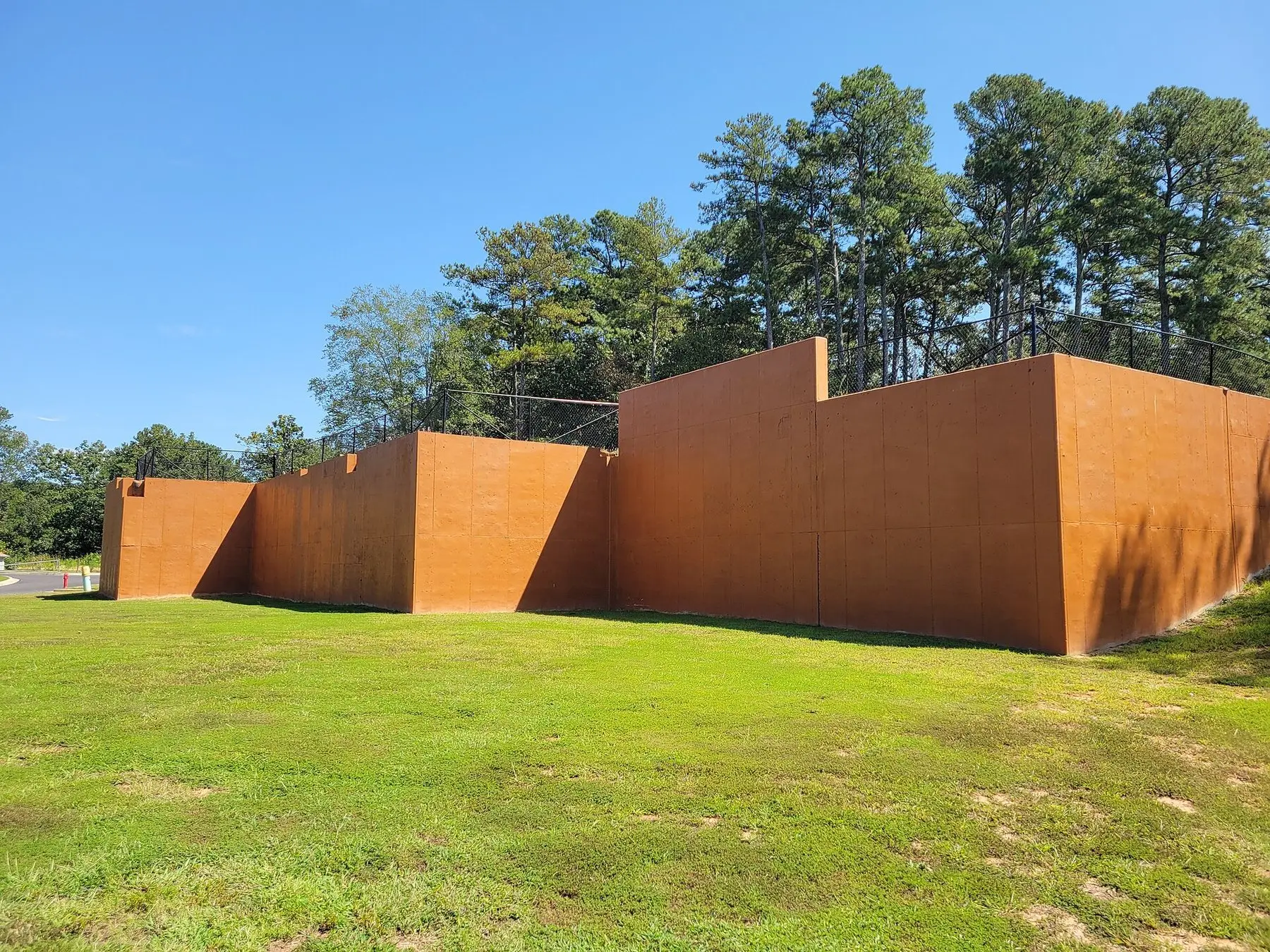 A low retaining wall stepping across a sloping lawn